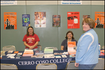 Cerro Coso Financial Aide staffers Mellissa Pearson and JoAnn Spiller chat with Vice President of Student Leaning, Jill Board