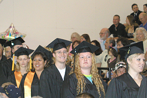Happy graduates enter the hall.