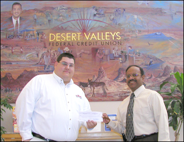 Receiving the check is CEO Eric Bruen of Desert Valley from CCCC Foundation President Solomon Rajaratnam.