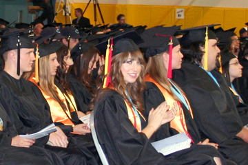 Graduates listen intently to speakers