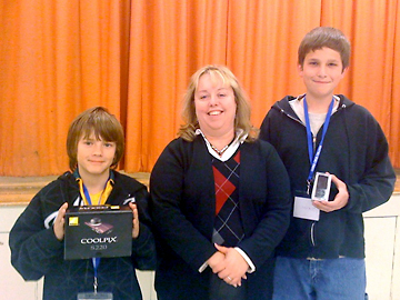 Bradley Sutton from Murray Middle School won the camera and Brandon Jensen from Burroughs High School won the IPod, pictured here with Valerie Karnes, Dean of Career Technical Education from Cerro Coso