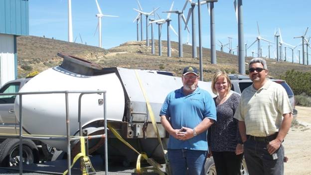Larry Board, Carolyn Whiles, and Raudel Castanon with Donated Turbine